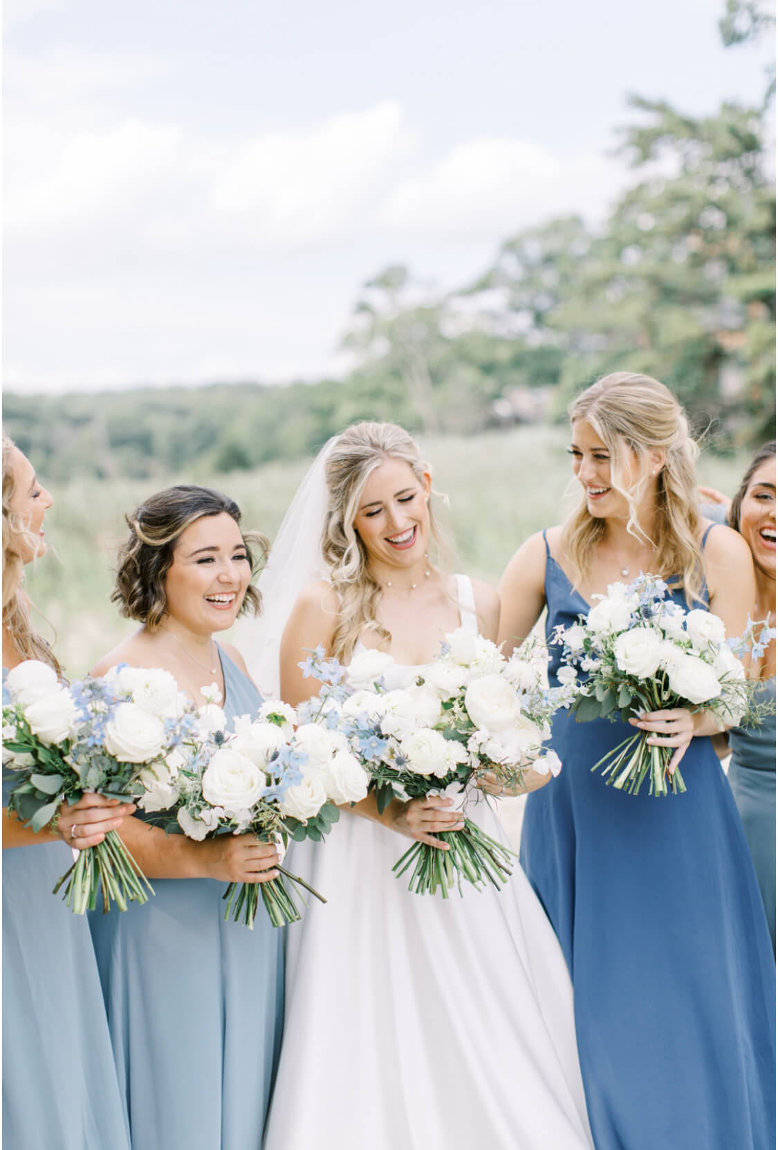 Summer garden style bride & bridesmaids wedding bouquets with white & light blue.